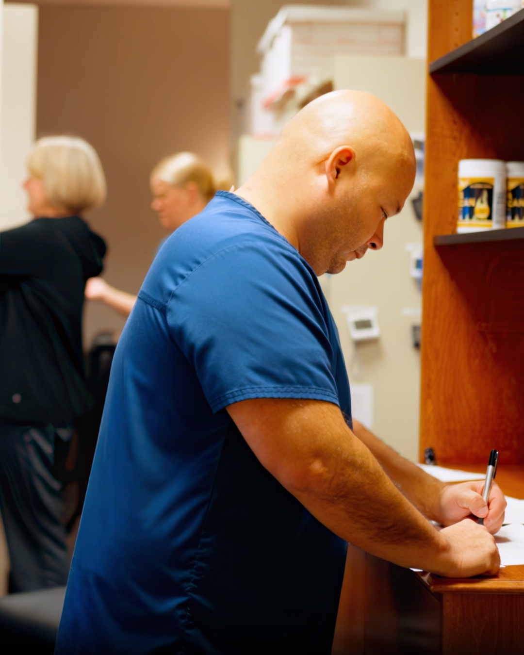 [Describe the real photo, e.g. a RiverCrest Health team member talking with a patient during a consultation]