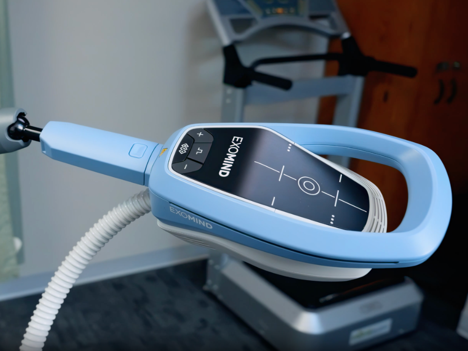 [Describe the real photo, e.g. the Exomind device in a RiverCrest Health treatment room]