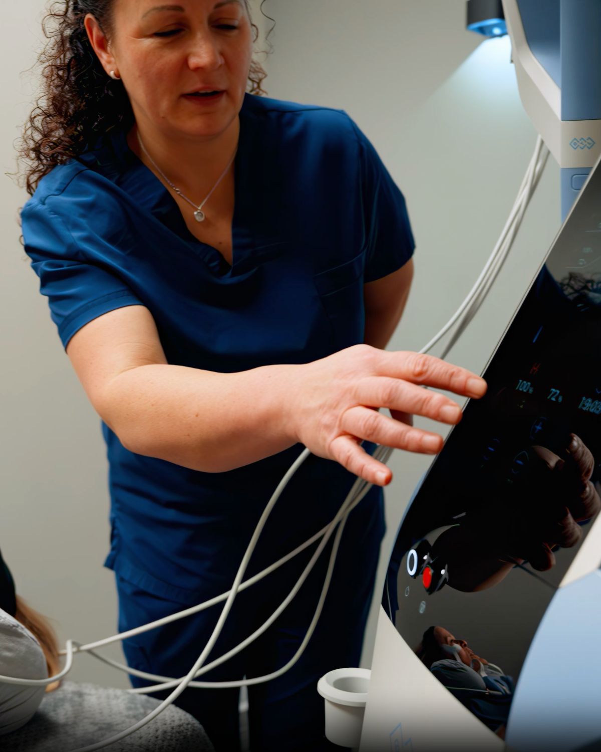 [Describe the real photo, e.g. a RiverCrest Health team member talking with a patient in the clinic]